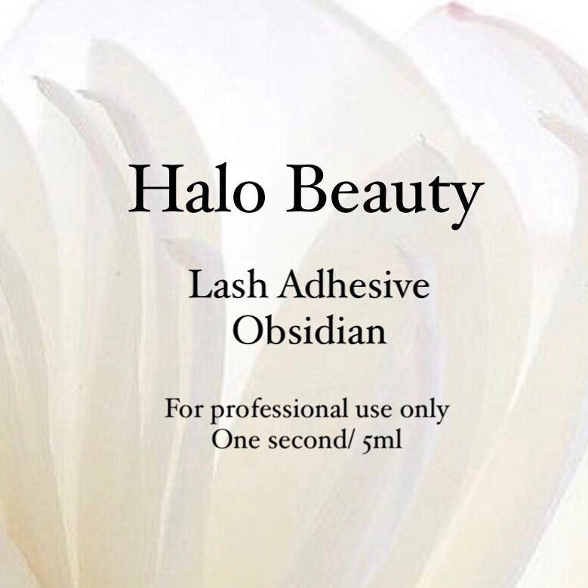 Lash adhesive with Halo Beauty text, white background, black text, for professional use only