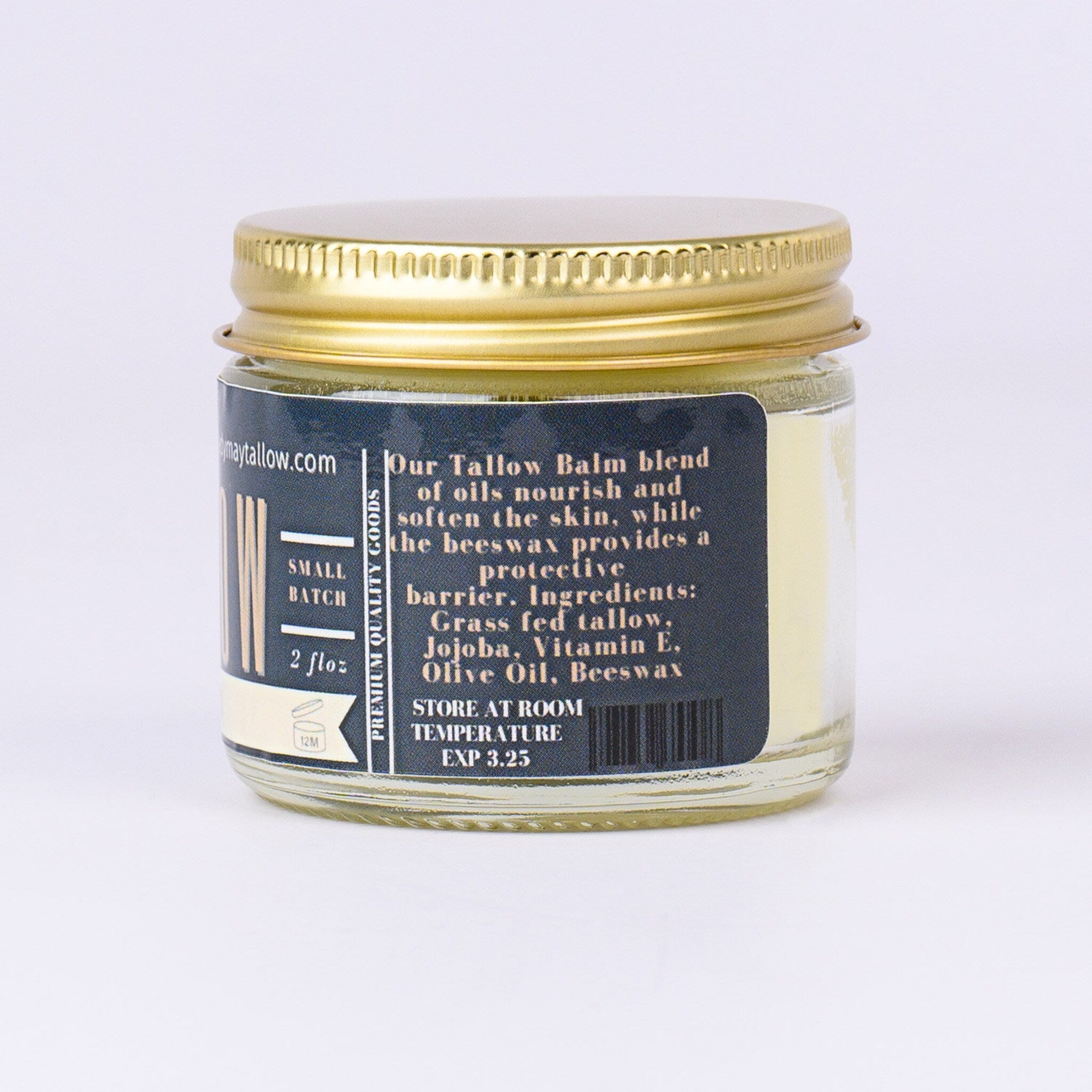 Tallow balm jar with gold lid, glass container, and product label with text