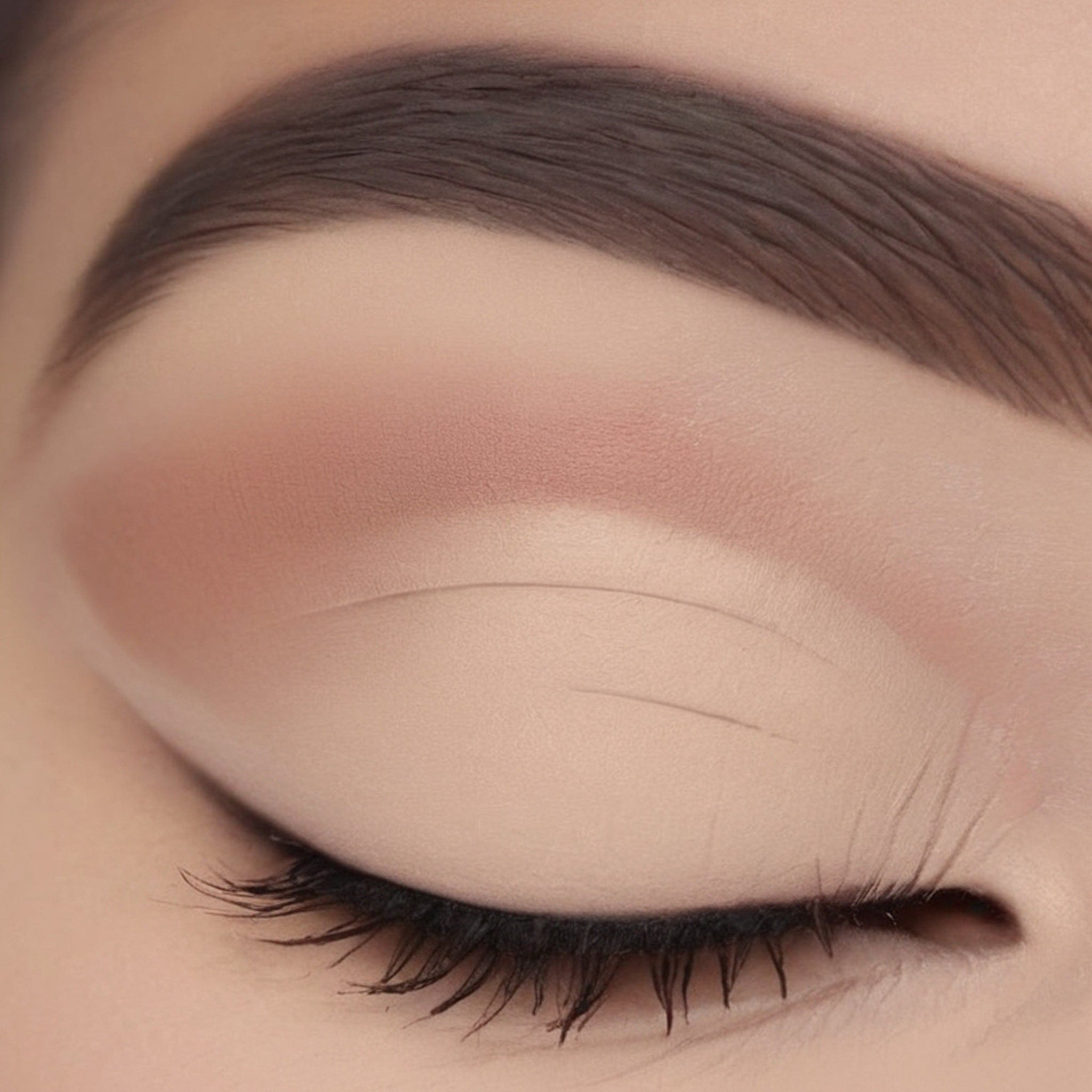 Single matte beige eyeshadow pan with smooth powder texture in minimalist white compact