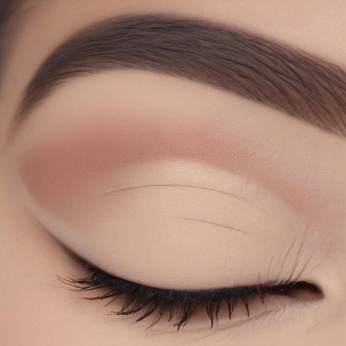 Single matte beige eyeshadow pan with smooth powder texture in minimalist white compact