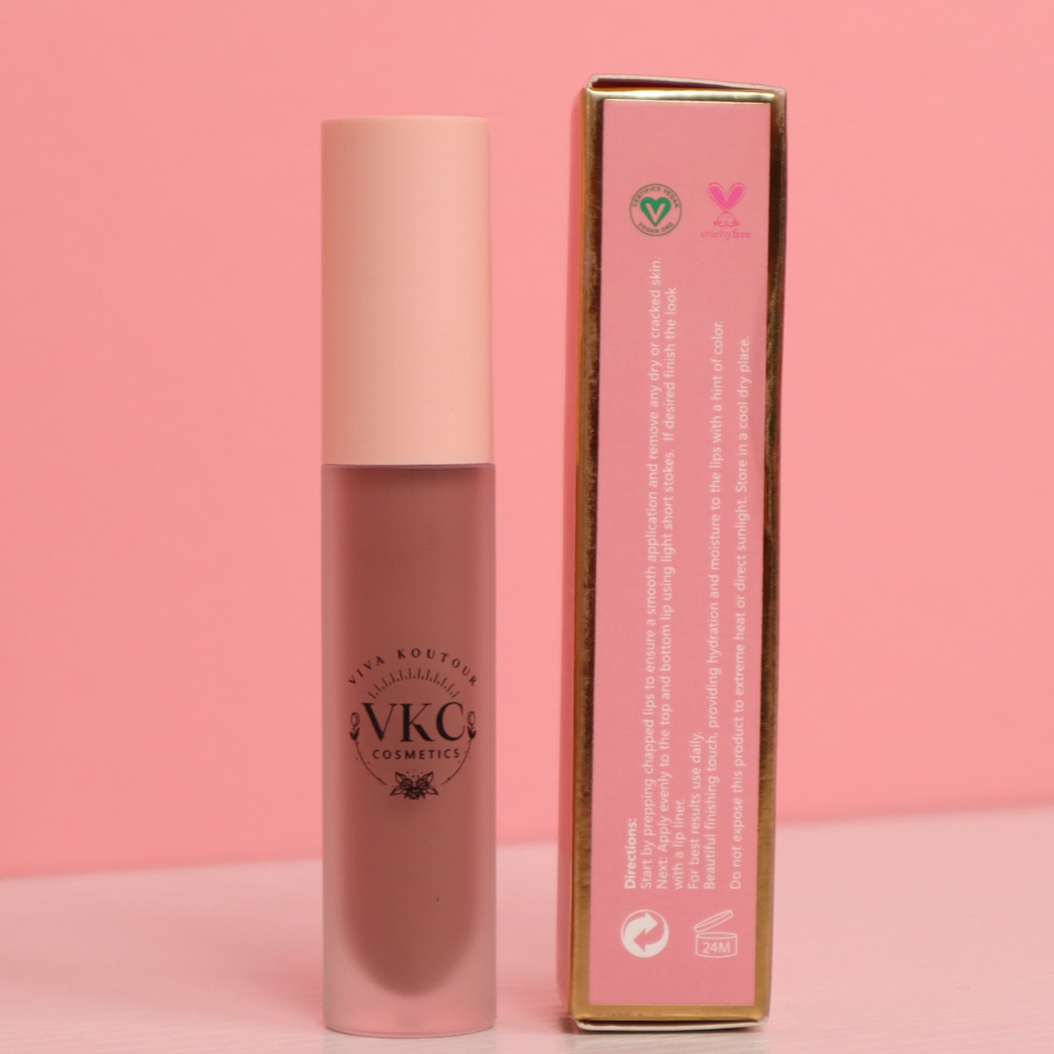 Lipstick tube with pink and brown color, VKC Cosmetics brand visible, with matching box beside it