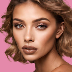 Lipstick, glossy brown, on a woman's lips, with brown eye makeup and wavy hair
