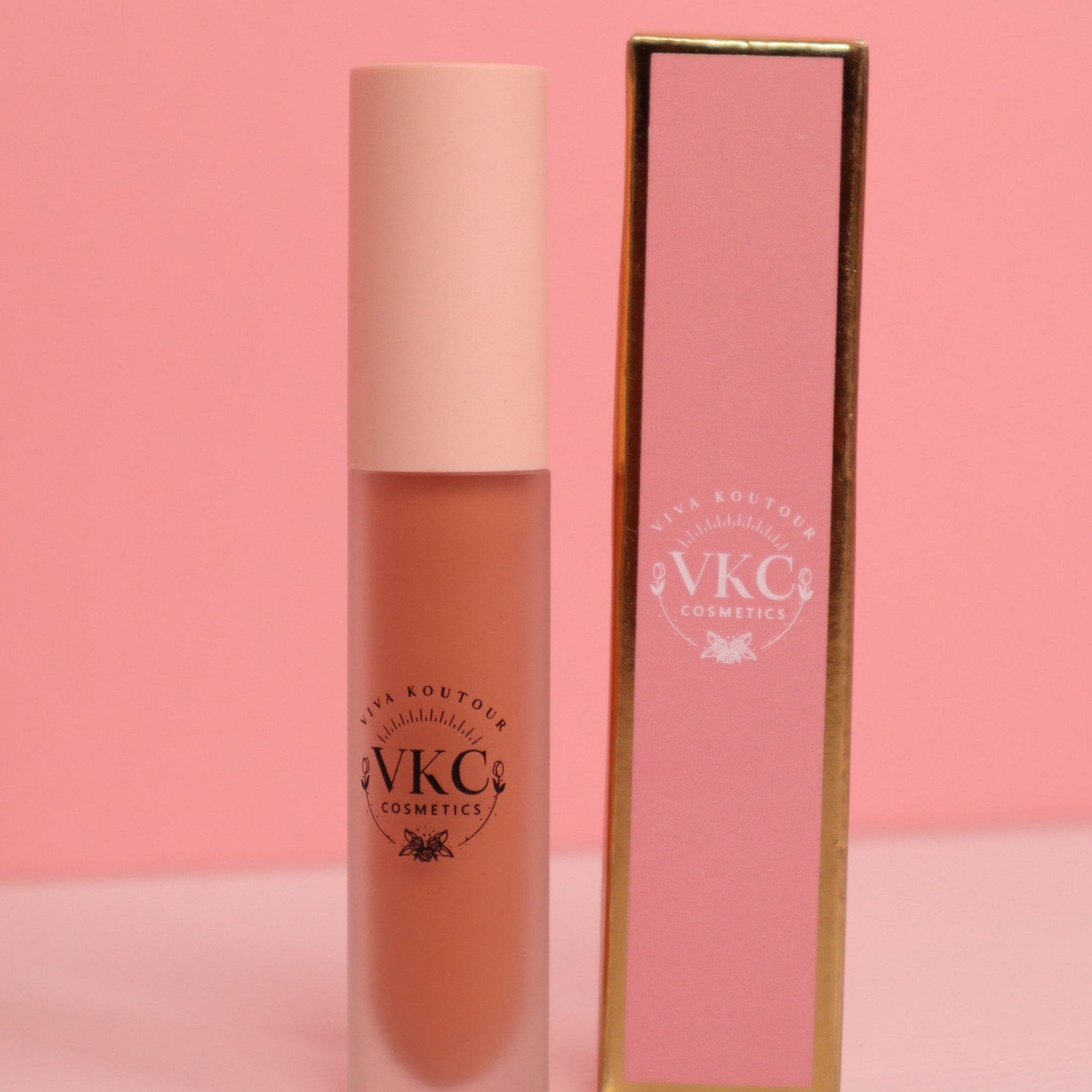 Lipstick tube with pink and peach tones, frosted glass, and VIVA KOUTOUR branding on the front