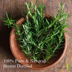 Rosemary sprigs in a brown ceramic bowl with green leaves on a wooden surface