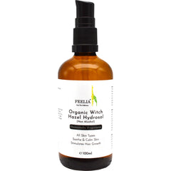 Witch hazel hydrosol bottle, brown glass, black pump, white label with text