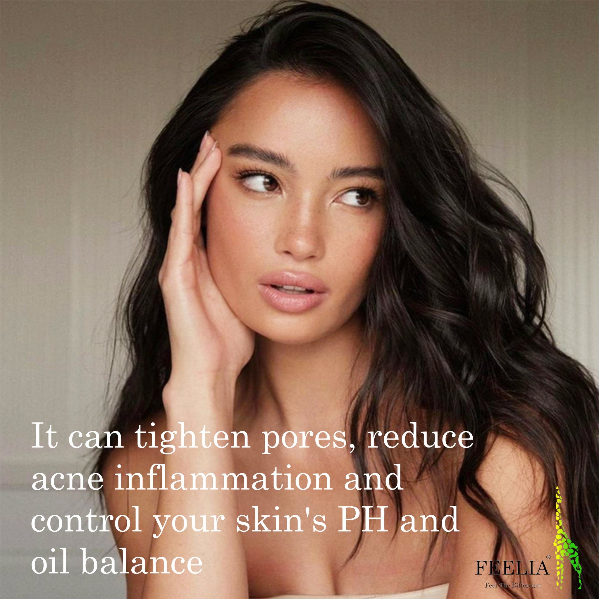 Woman with dark hair, fair skin, and hand on face, FEELIA logo in corner