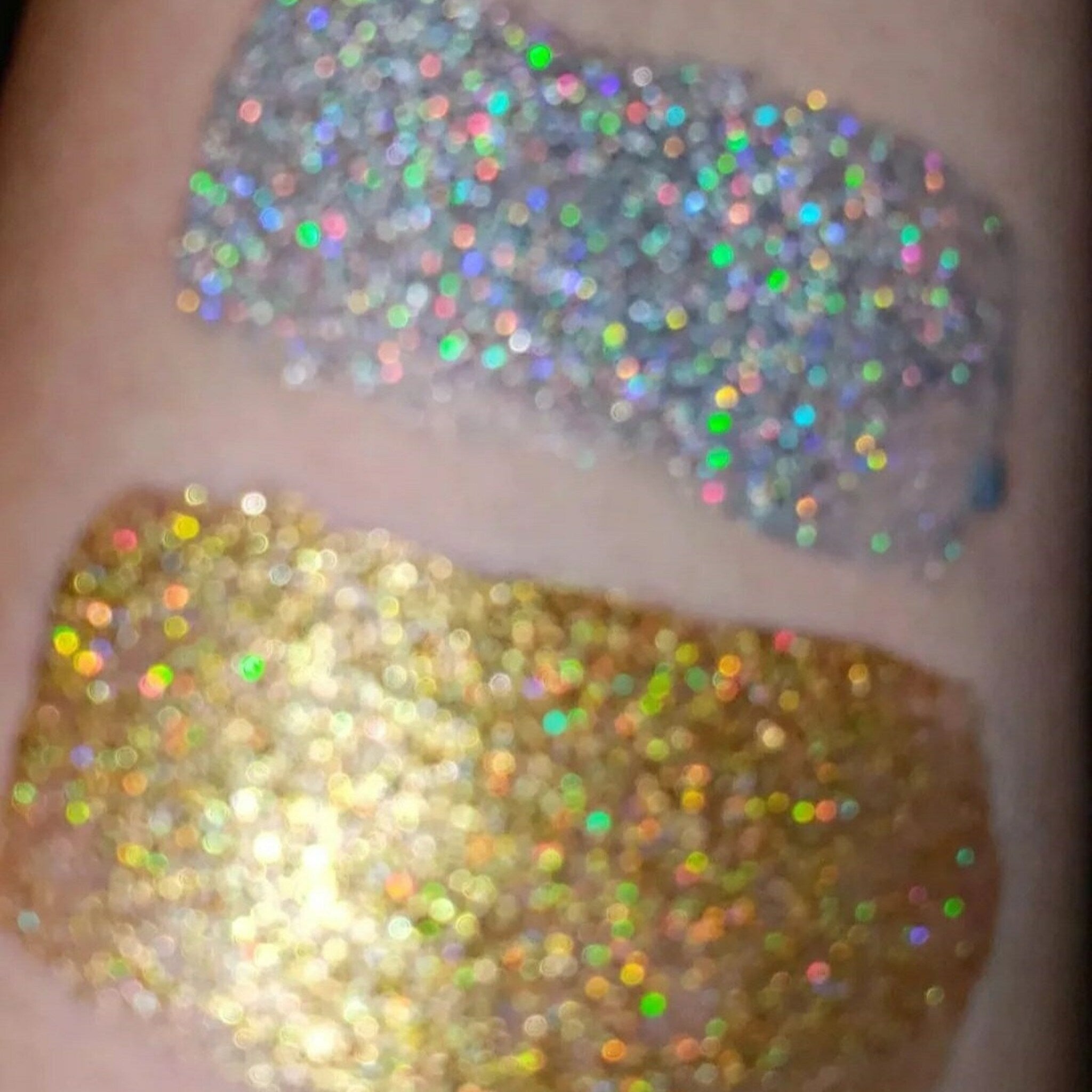 Close-up of loose shimmering glitter eye shadow catching light with vibrant sparkle and fine texture