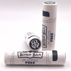 Lip balm tubes in white with black accents and Bonbon Balm text visible