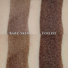 Hand applying Cherry Truffle shimmer eyeshadow with fingertip, showing dark rose brown loose powder blending on eyelid