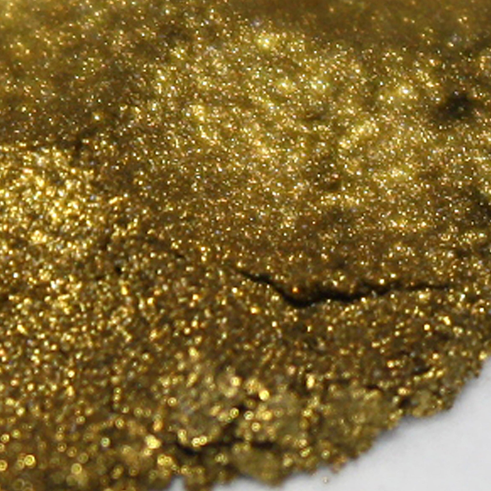 Gold glitter with a textured, sparkly surface, close-up shot