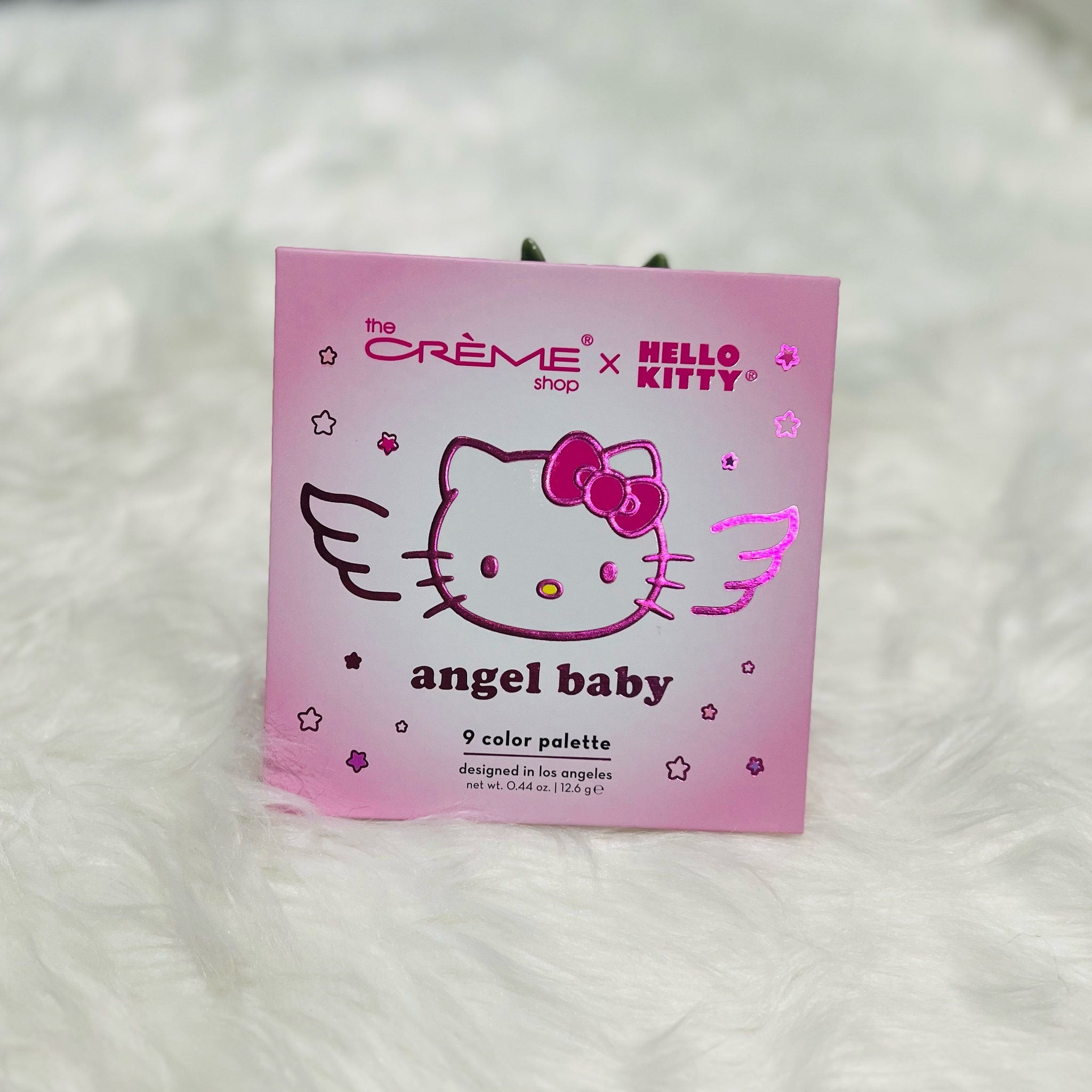 Side view of Hello Kitty Angel Baby Eyeshadow Palette showcasing pastel pink packaging and shimmer shades