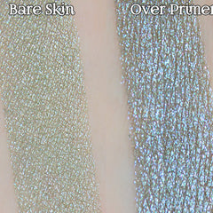 Hand applying shimmery grey taupe eyeshadow with lavender duochrome using a fluffy brush