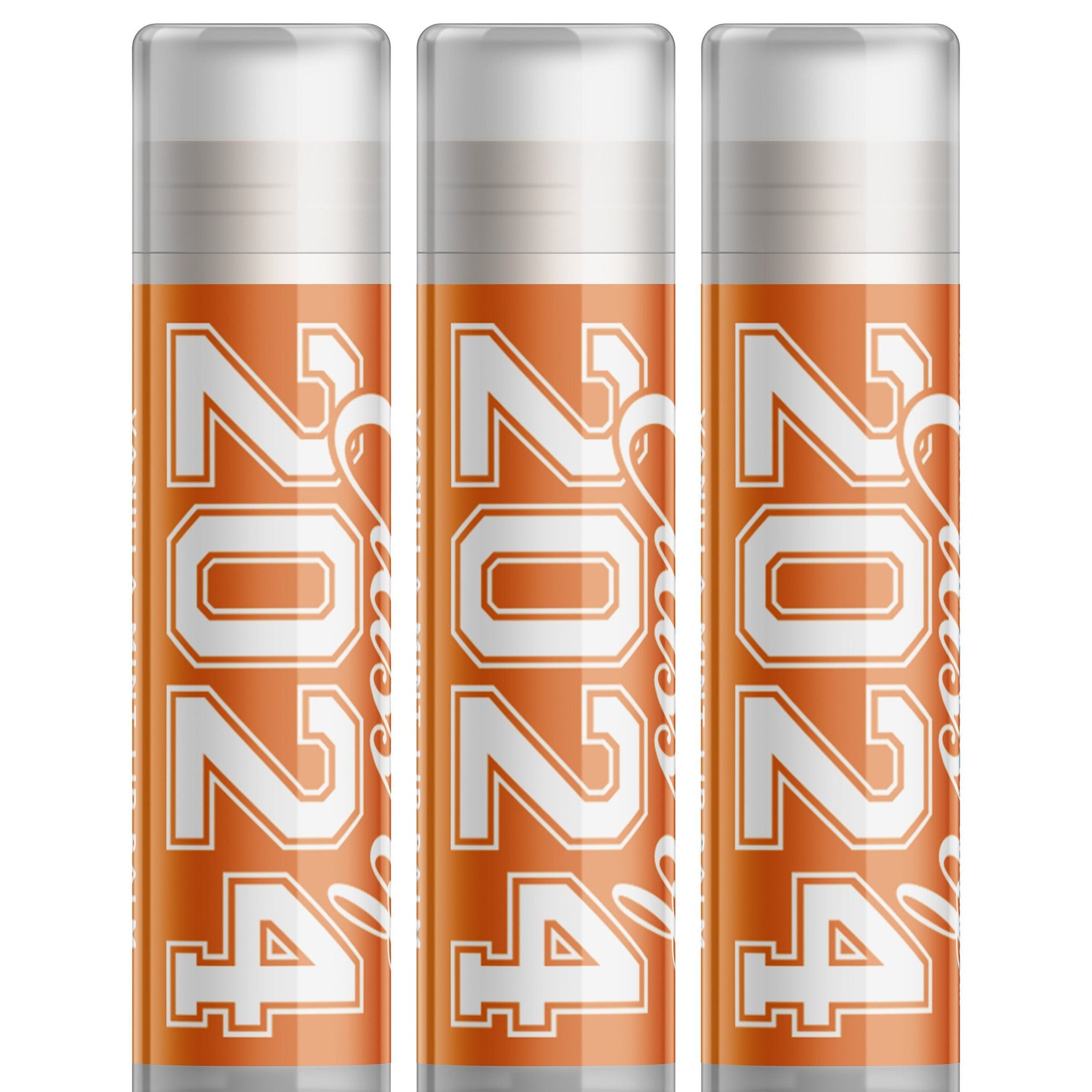 Lip balms, orange tubes with white text "2024", three pack, Delight Naturals brand