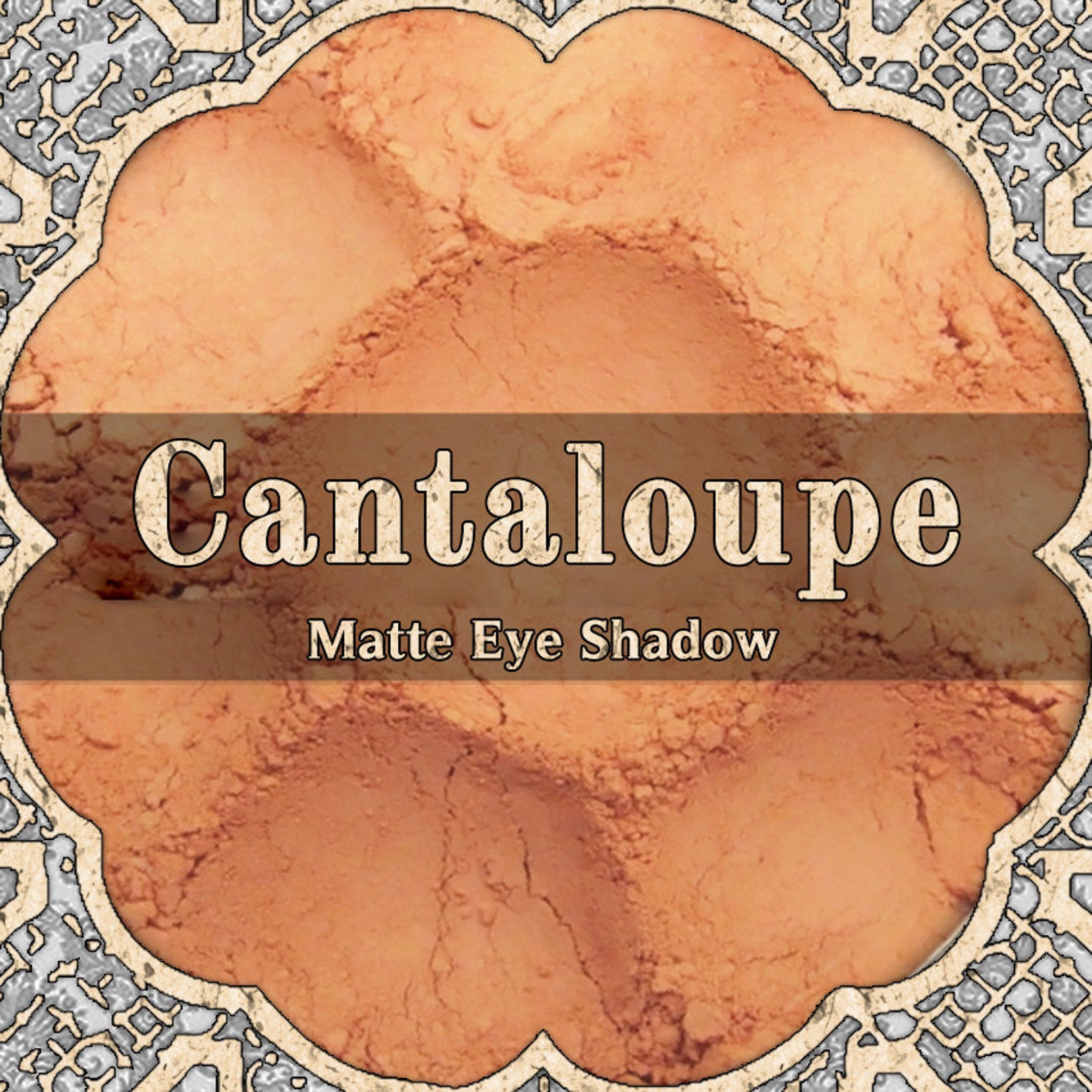 Matte cantaloupe orange eyeshadow pan with smooth powder texture in compact packaging