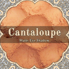 Matte cantaloupe orange eyeshadow pan with smooth powder texture in compact packaging