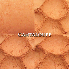 Side view of matte cantaloupe orange eyeshadow pan showing powder texture and compact size
