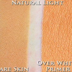 Hand applying matte cantaloupe orange eyeshadow with fingertip onto eyelid for soft pastel makeup look