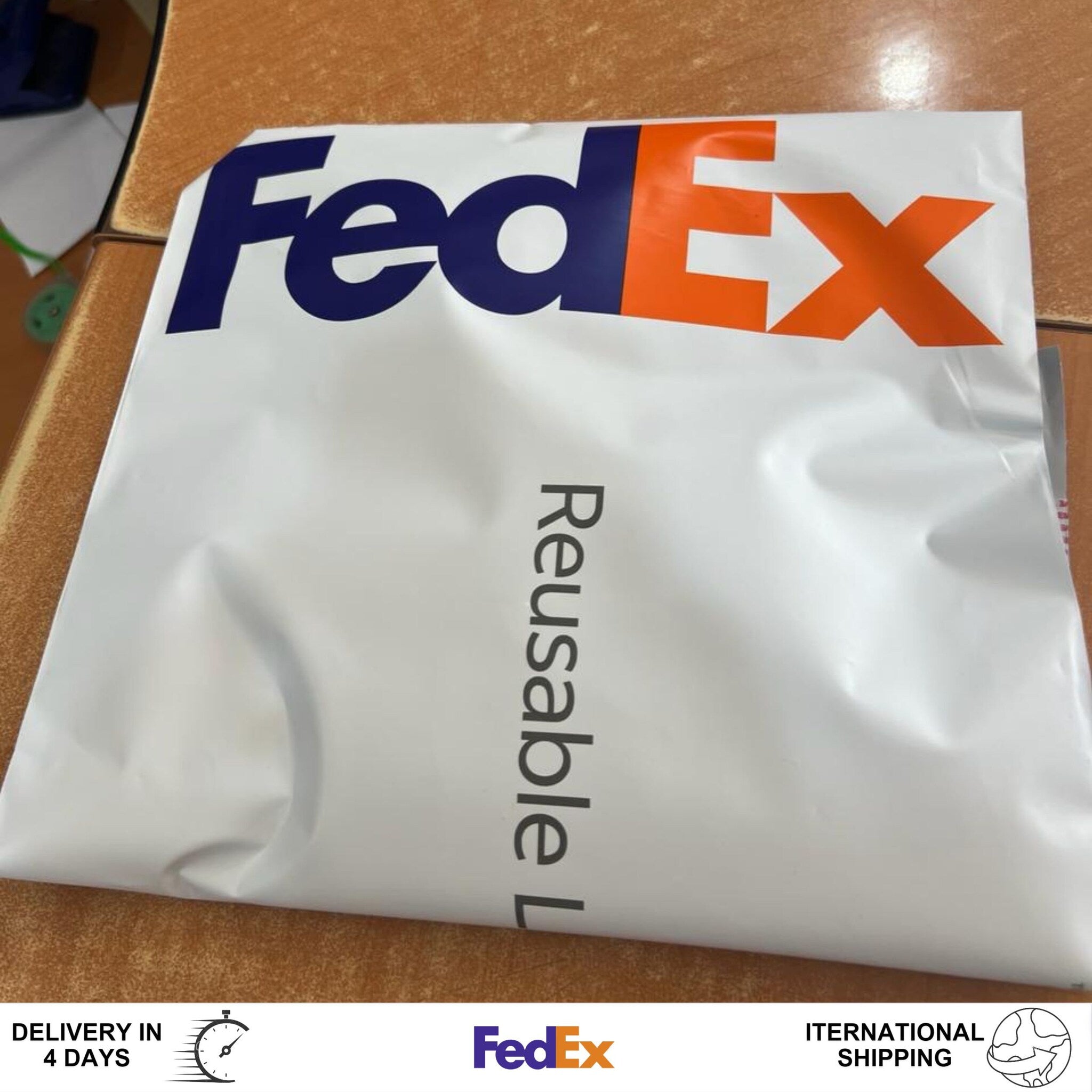 FedEx shipping envelope, white and blue logo, reusable material with text