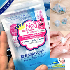 Facial cleanser powder in clear plastic packaging, with "suisai" brand text visible, and white powder inside.