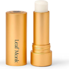 Lip balm, gold metallic tube, white balm, Leaf Monk brand visible, open and closed