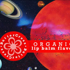 Lip balm flavor oil with red and white text, red planet background, and space elements