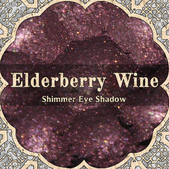 Dark magenta pink and plum vegan loose powder eyeshadow with shimmer in a goth romantic shade called Elderberry Wine.