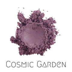 Vegan mineral eyeshadow pot in cosmic garden shade, showcasing vibrant purple duochrome shimmer with eco-friendly packaging