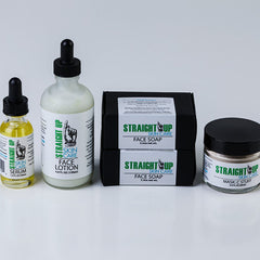 Skincare set with yellow serum bottle, white lotion bottle, black soap boxes, and jar with Straight Up Skin Care text
