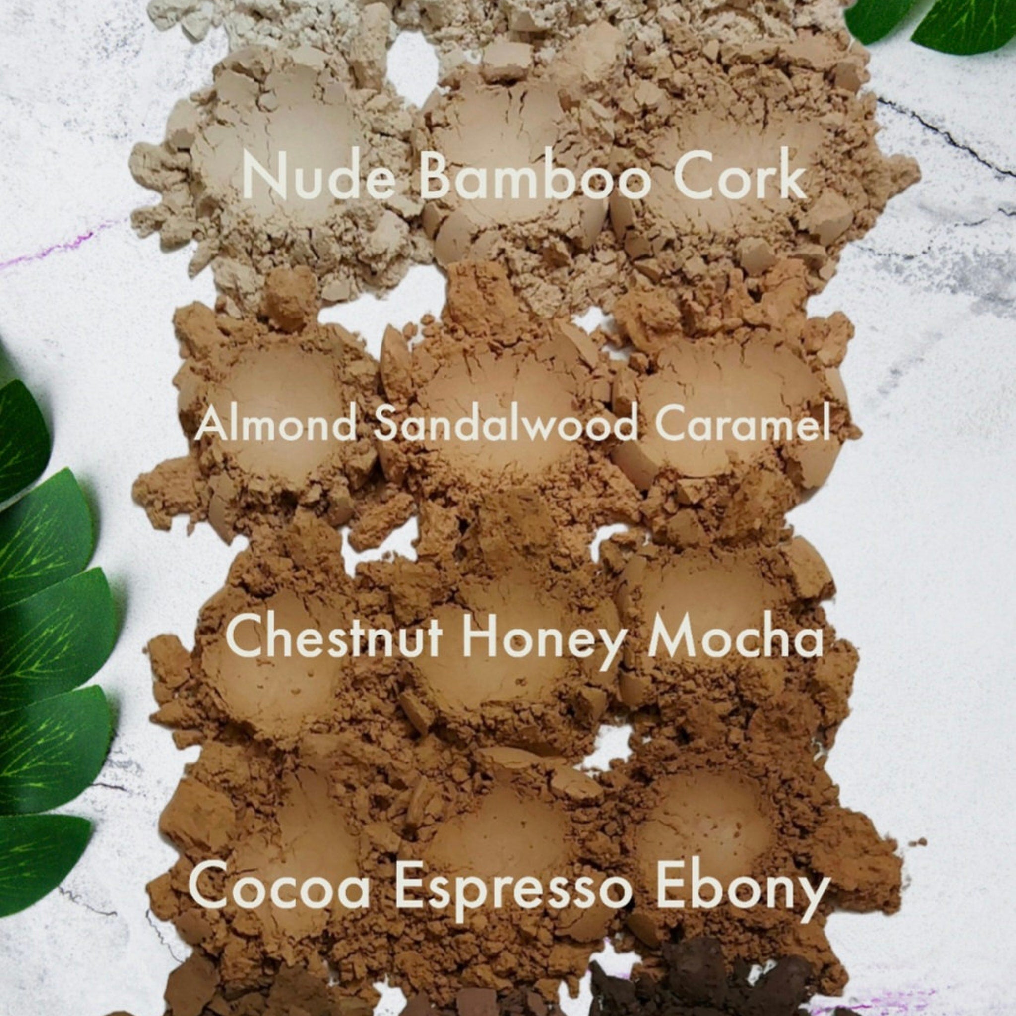 Side view of vegan mineral eye shadow samples in round pans showing textured powder surface and earthy tones