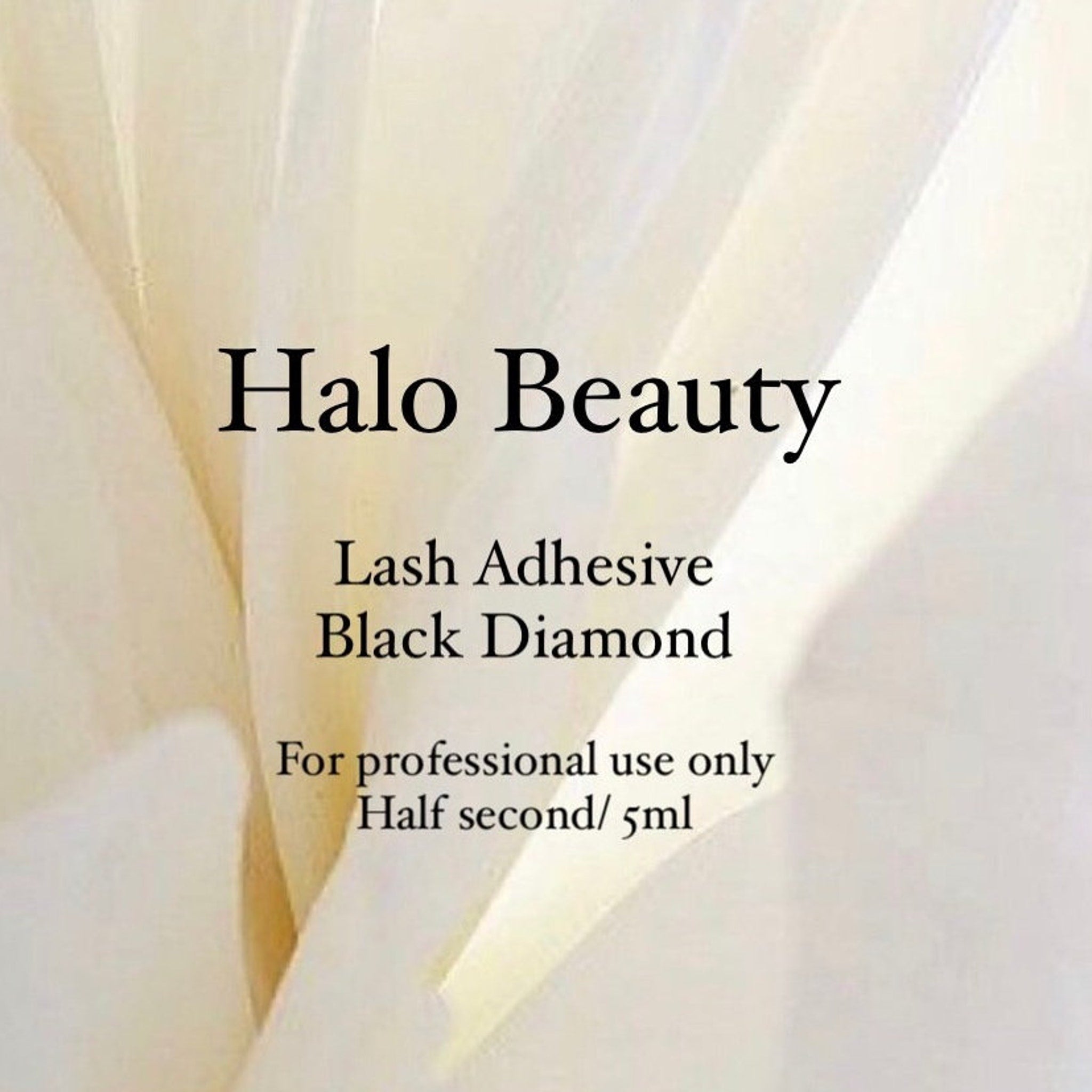 Lash adhesive with Halo Beauty text, black text on white background, for professional use