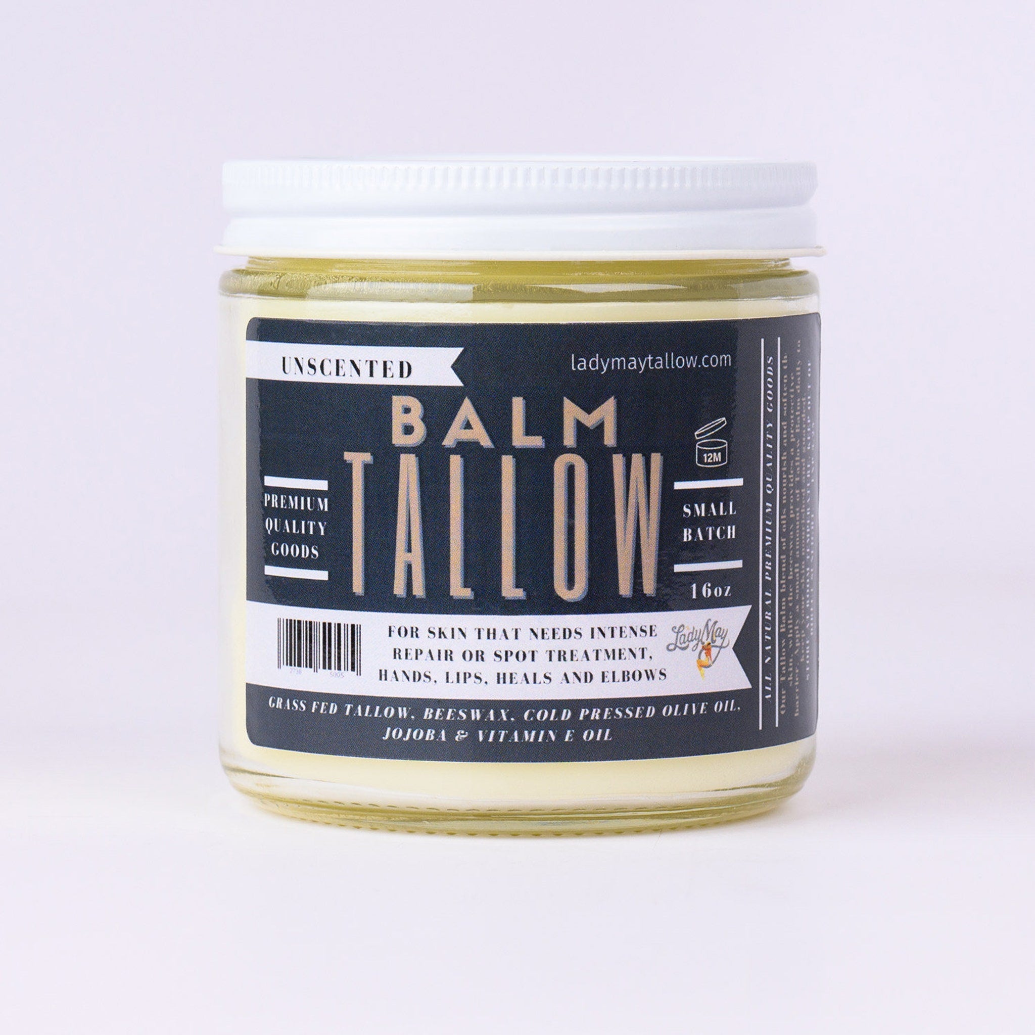 Tallow balm jar with white lid, clear glass, and Lady May's label