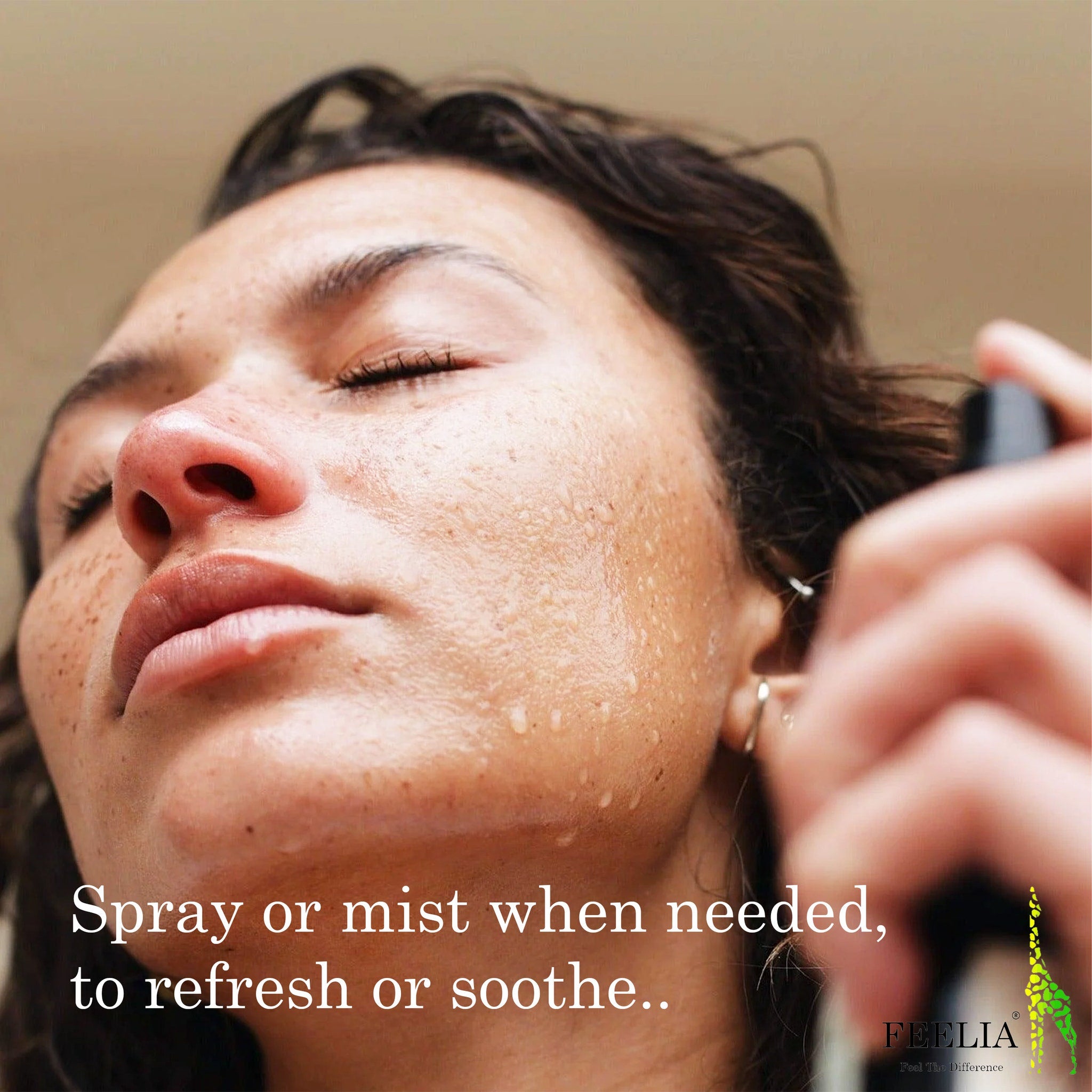 Facial mist on skin with water droplets, close-up of face, FEELIA brand text visible