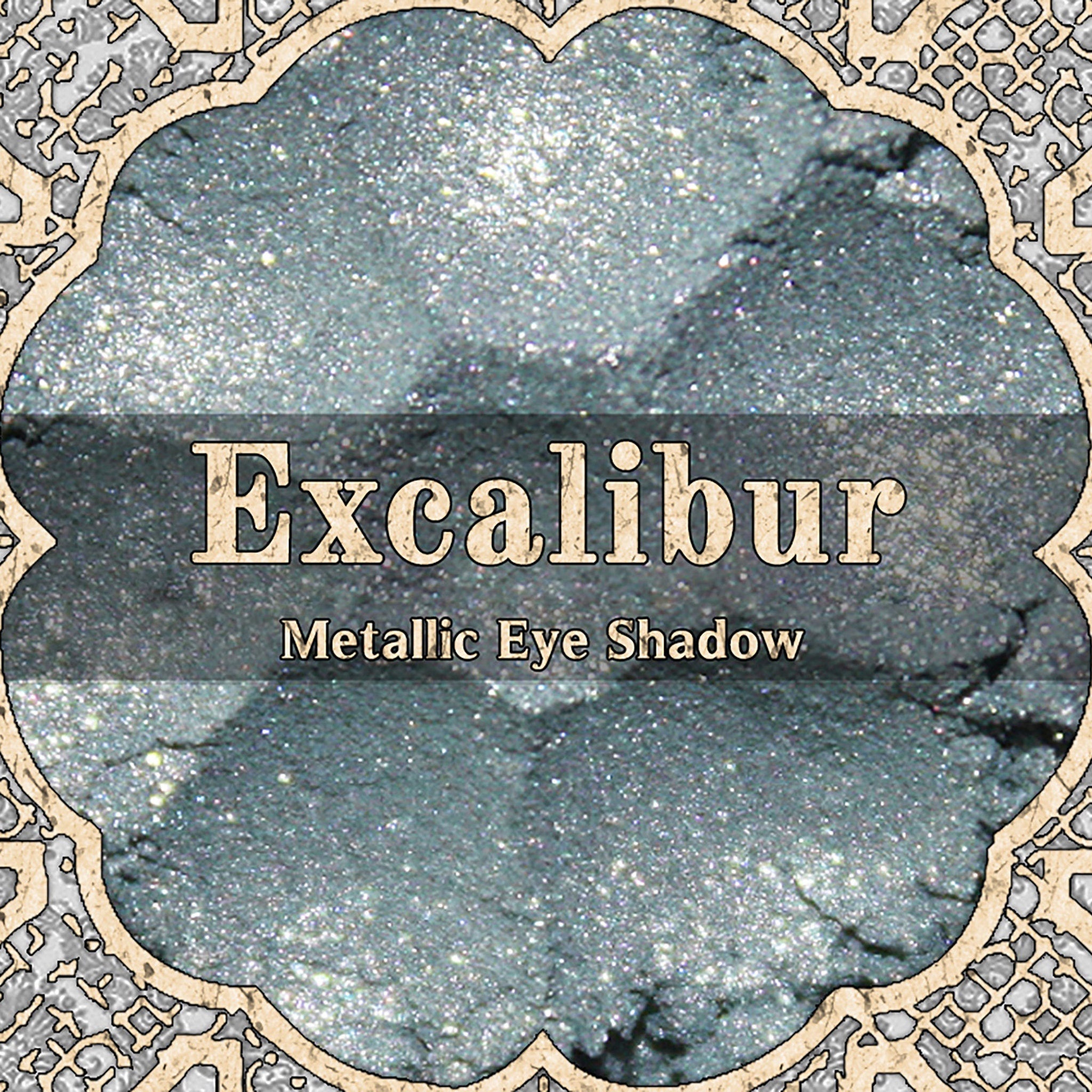 Metallic loose powder eyeshadow in light silver blue shade from the vegan Camelot Collection, sparkling texture shown.