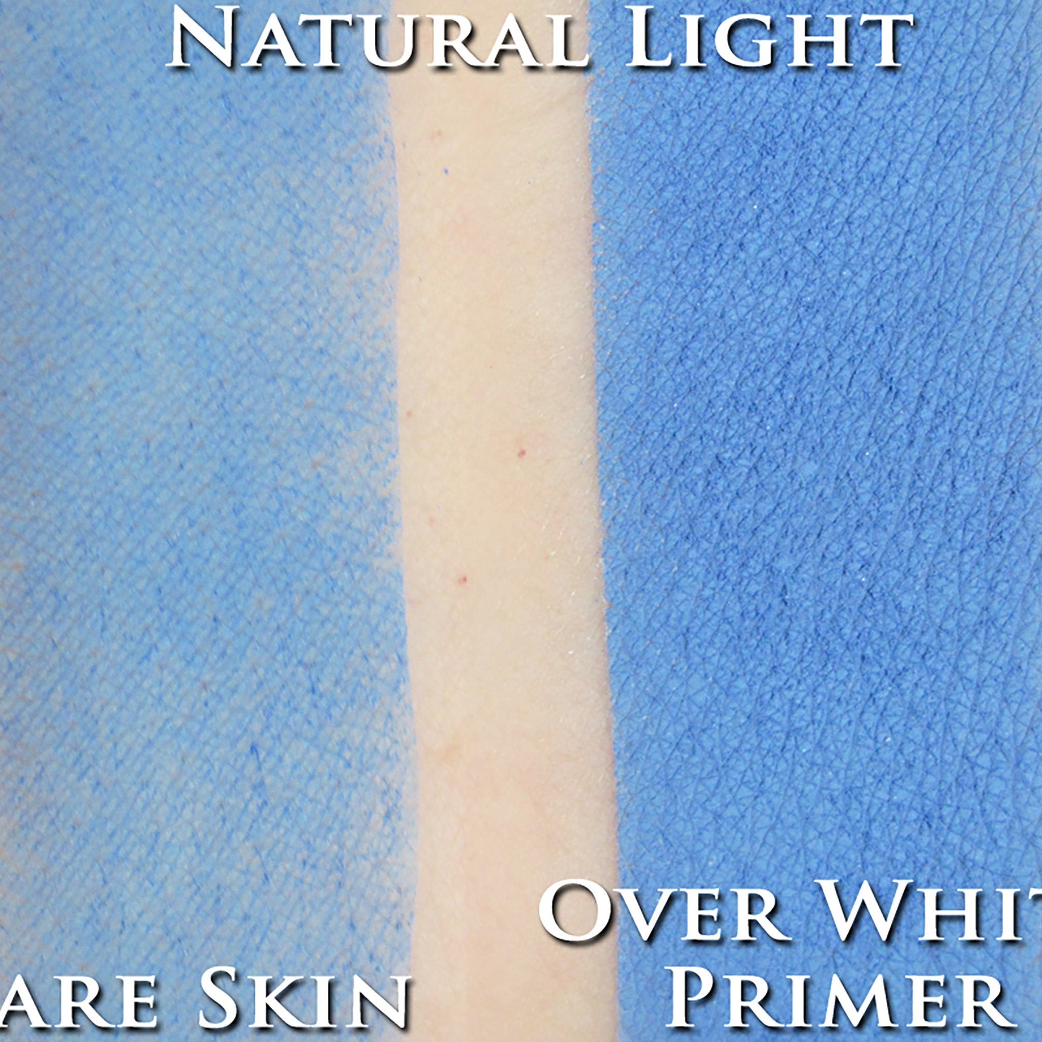 Hand applying light powder blue vegan matte eyeshadow pigment with a fluffy brush for soft blended coverage
