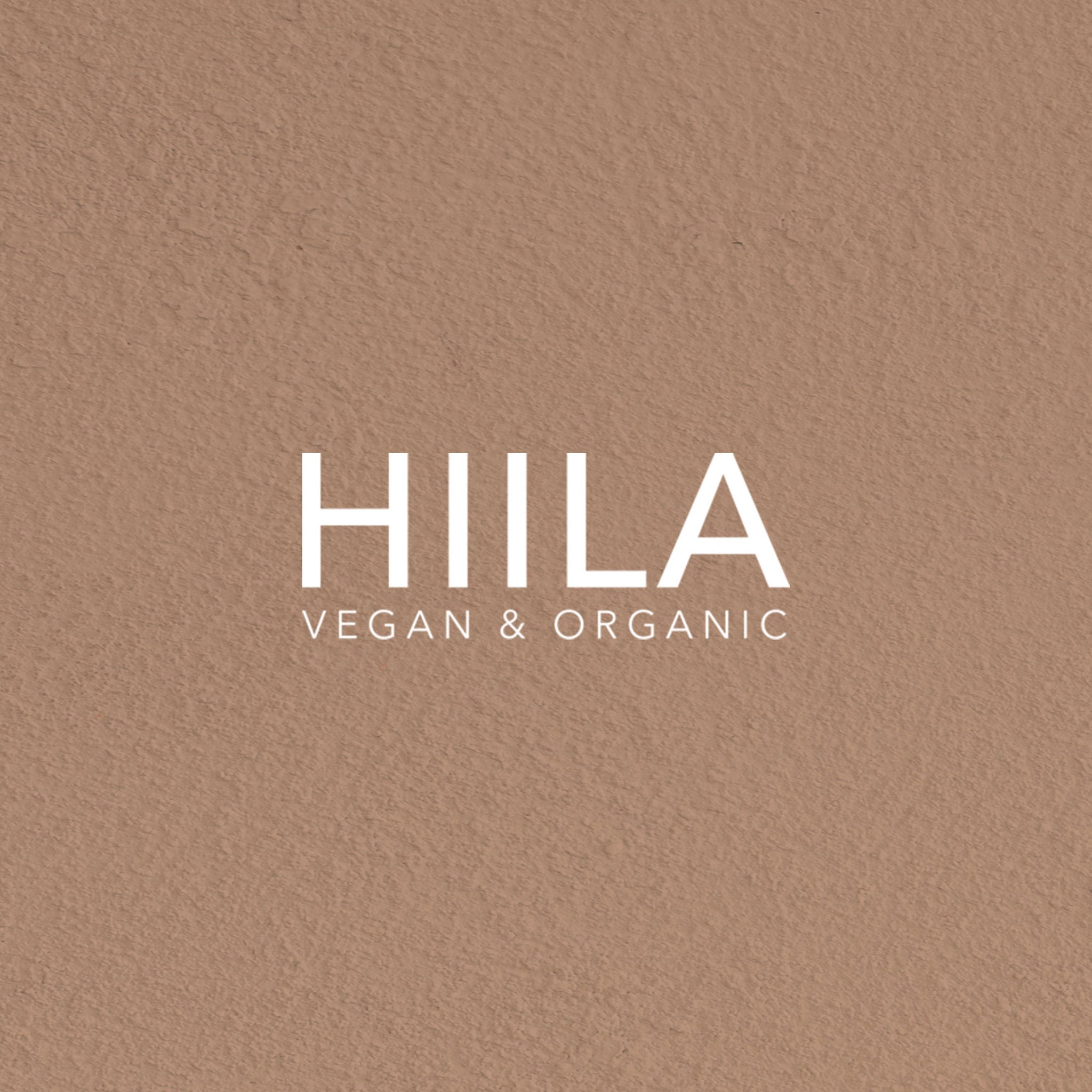 HILA logo on textured brown background with white text, Vegan & Organic branding