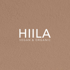 HIILA logo on textured brown background, white text, Vegan & Organic branding