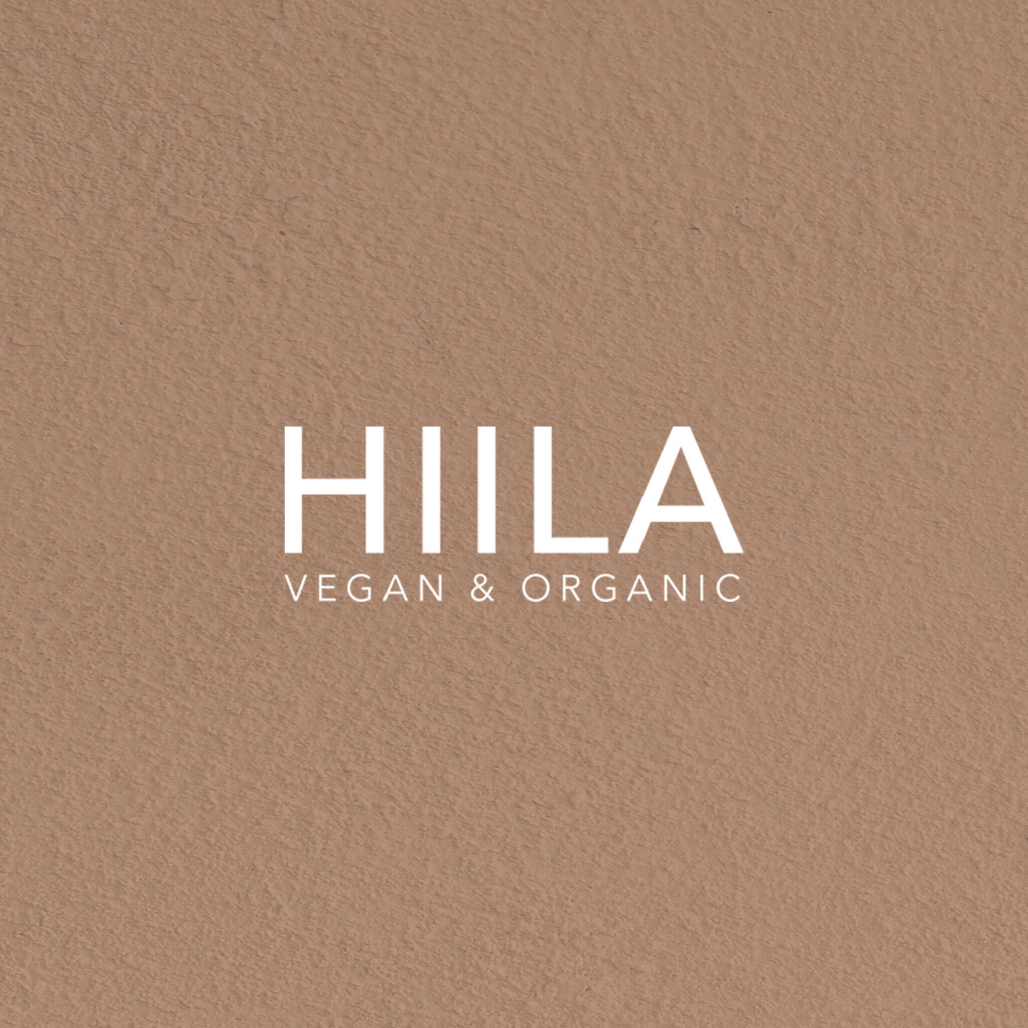 HIILA logo on textured brown background with white text, Vegan & Organic