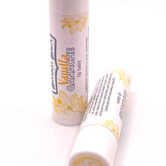 Lip balm with white tube, floral pattern, and Vanilla Ganache text label.
