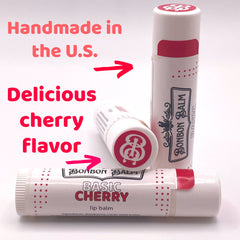 Lip balm tubes, white with red accents, Bonbon Balm brand, cherry flavor text visible