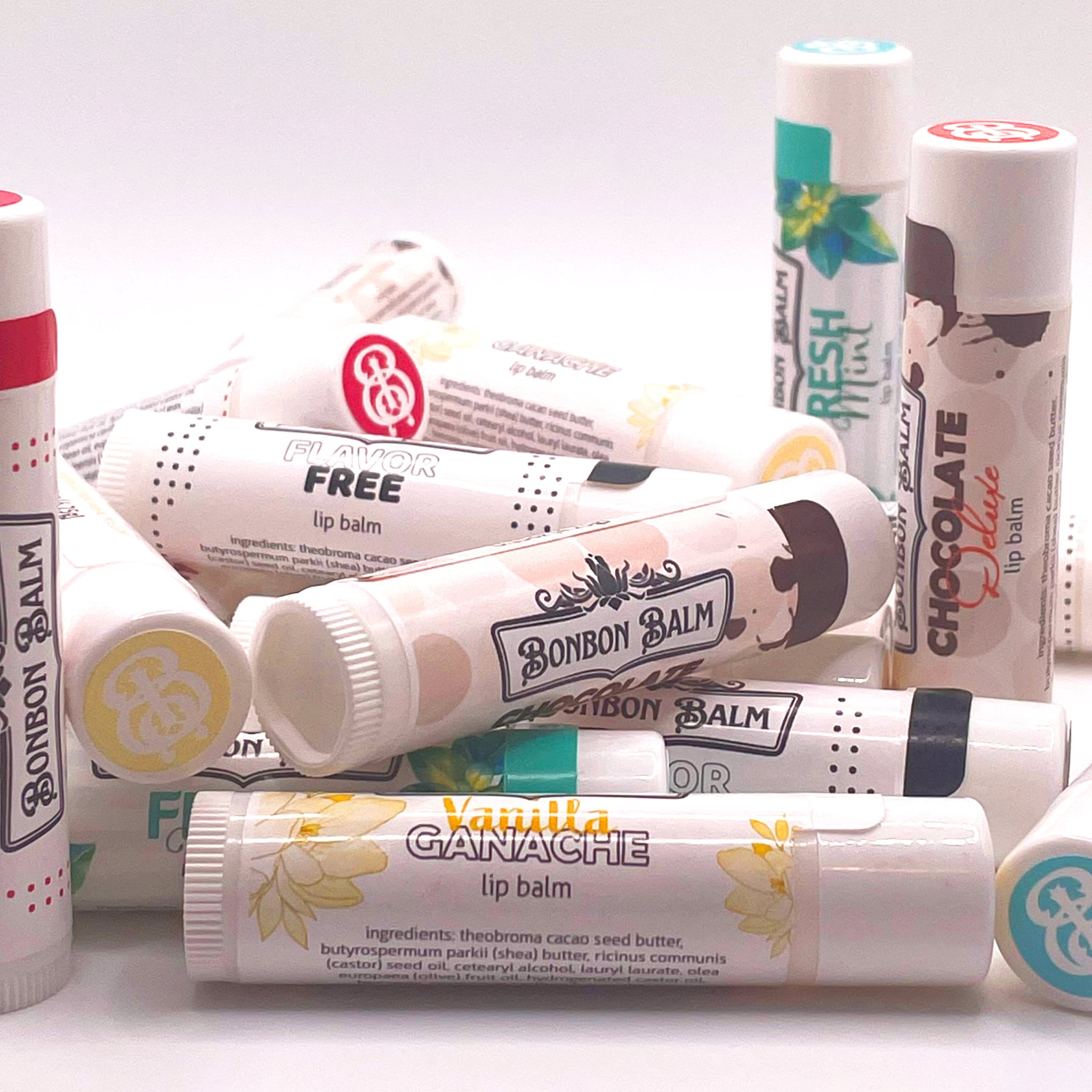Lip balm tubes in white with various text and designs, including BONBON BALM and Vanilla Ganache