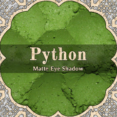 Vibrant matte bright green loose powder eye shadow in a sleek black container with python-inspired texture.