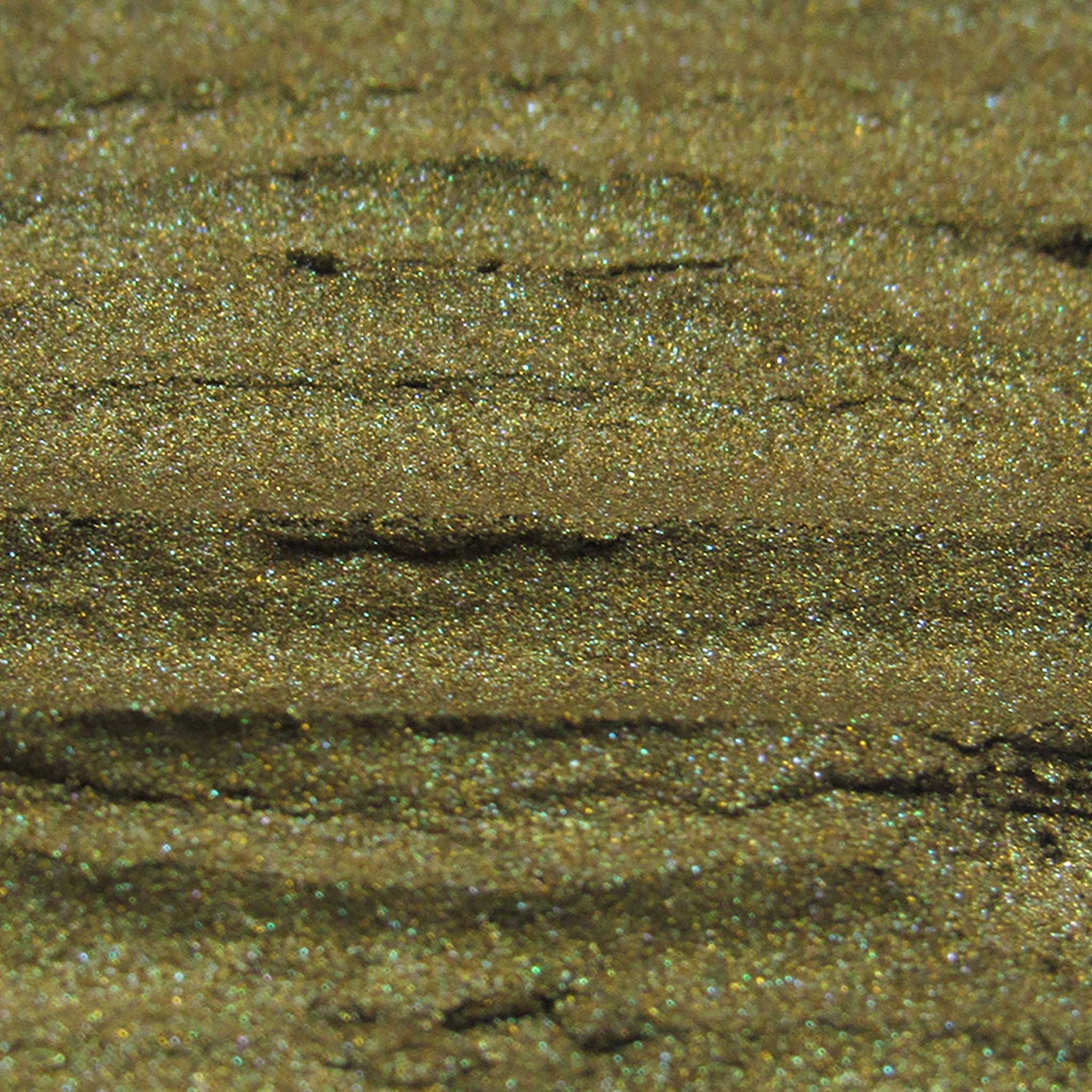 Glittery gold textured surface with horizontal lines and sparkling highlights