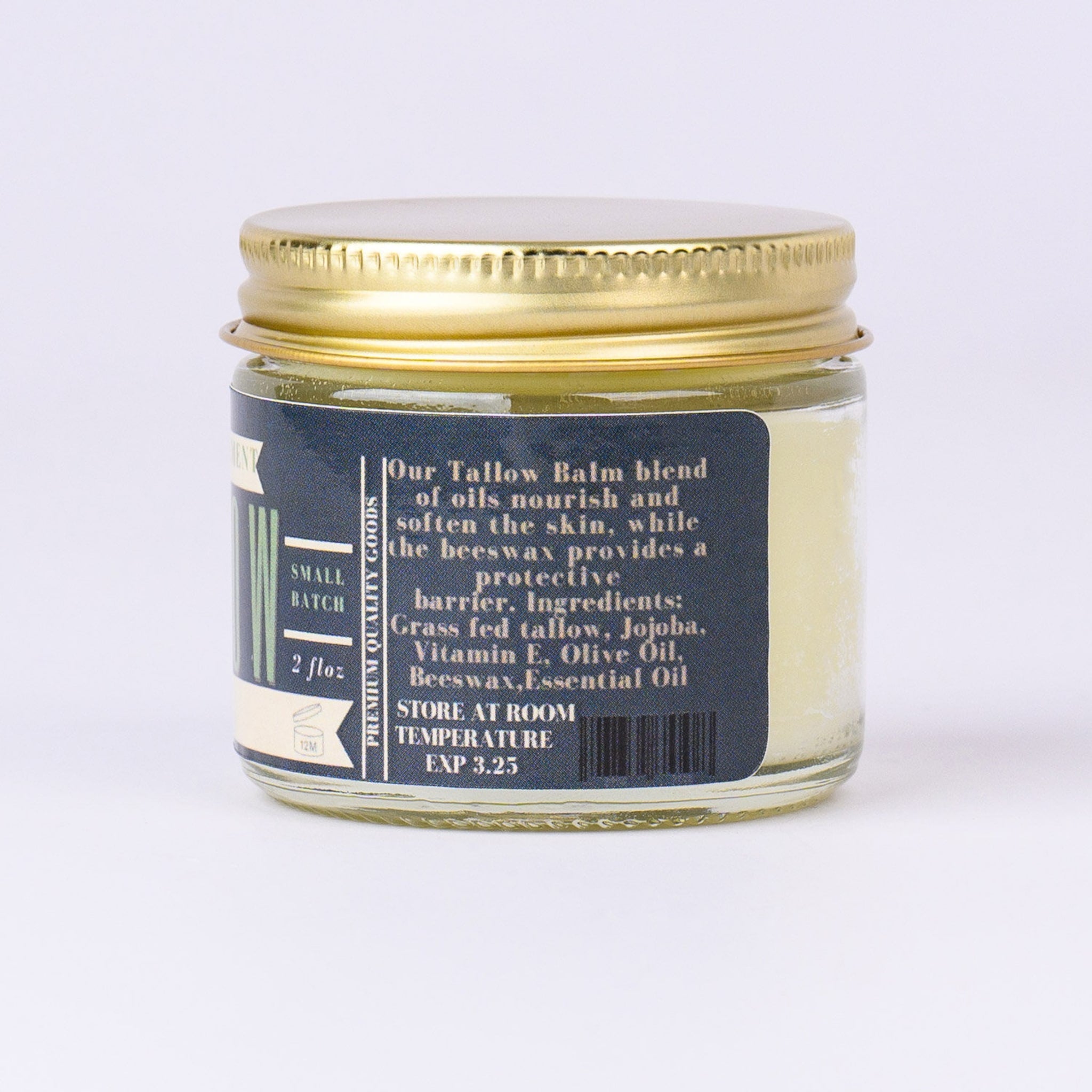 Tallow balm jar with gold lid and navy label, containing cream-colored balm, for skincare use