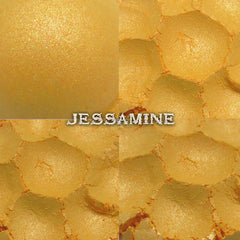 Side view of Jessamine duochrome eye shadow pot showing golden yellow shimmer shifting to orange in light