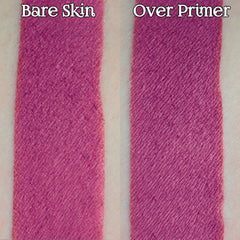 Hand applying deep pink matte loose powder eyeshadow with fingertip, showcasing vibrant pigment blend