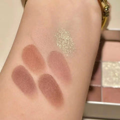 Close-up of pastel pink and lavender eyeshadows with shimmer finish in a sleek rectangular palette