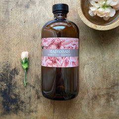 Facial Cleanser brown glass bottle, floral label, with Hadassah Beauty Oil Cleanser text