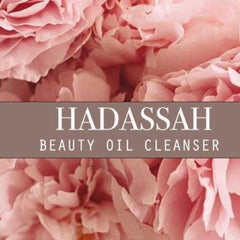 Beauty oil cleanser with pink floral background and HADASSAH text overlay