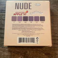 Eyeshadow palette with purple shades, theBalm brand name, and "NUDE" text on the box