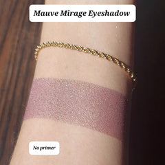 Close-up of vegan mauve eyeshadow with pink gold duochrome and bronze shimmer in compact pan